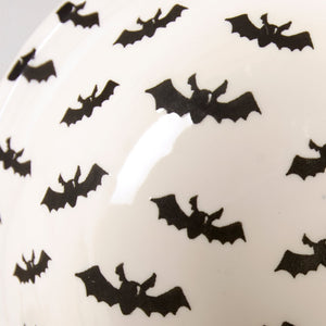 White ceramic jack o lantern bowl with black bat pattern perfect for spooky bowl set decor