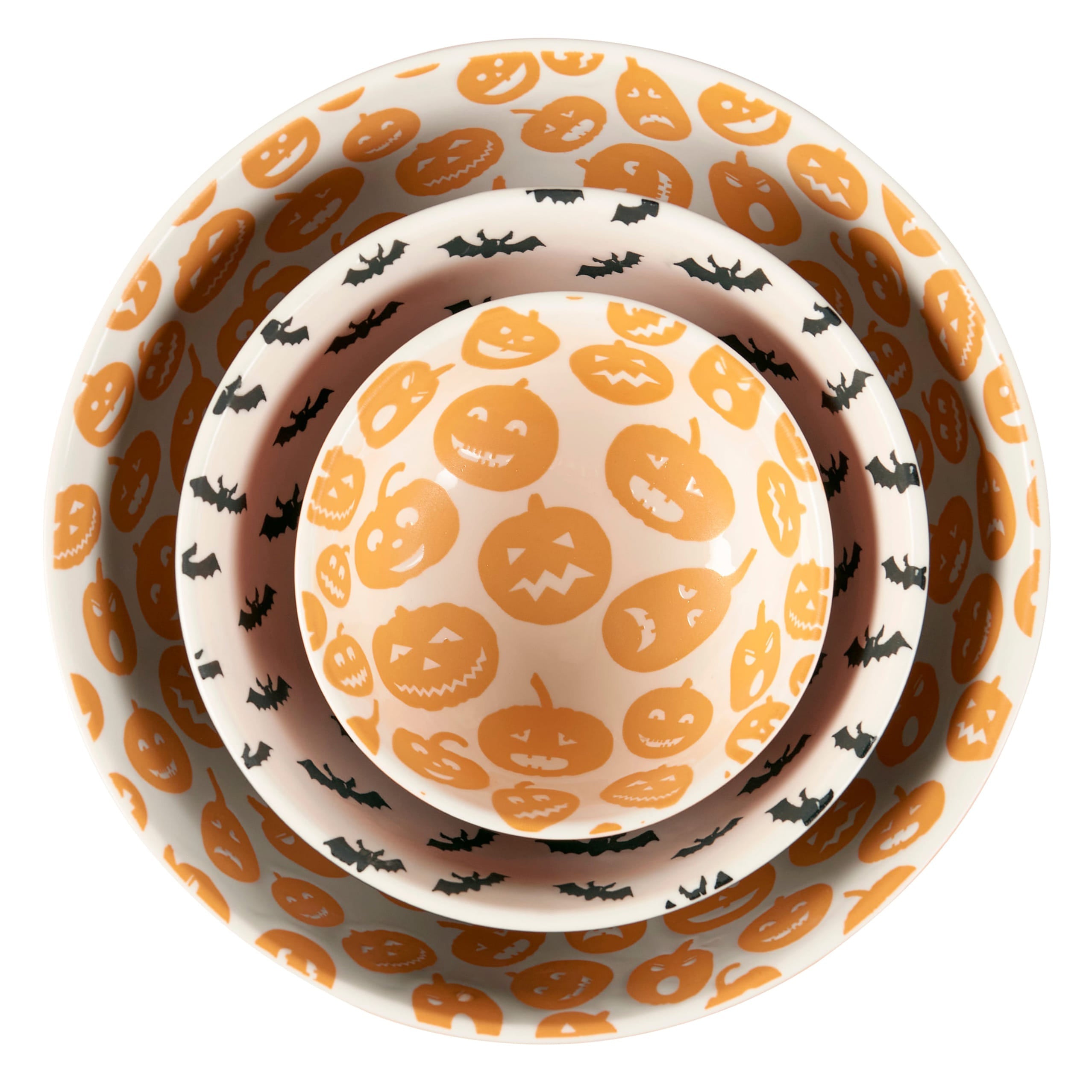 Set of three nested halloween-themed ceramic jack o lantern bowls with orange pumpkins and black bats on white background