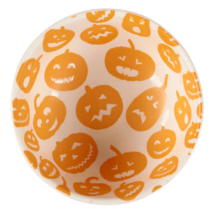 White ceramic jack o lantern bowl with playful orange pumpkin faces perfect for spooky bowl set collections