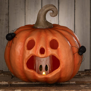 Jackie boo lantern orange halloween pumpkin with carved spooky face glowing candle and black glittery spiders side decor