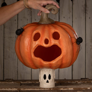 Orange carved jack o lantern pumpkin with black spiders and ghostly base perfect for halloween pumpkins and gourds display