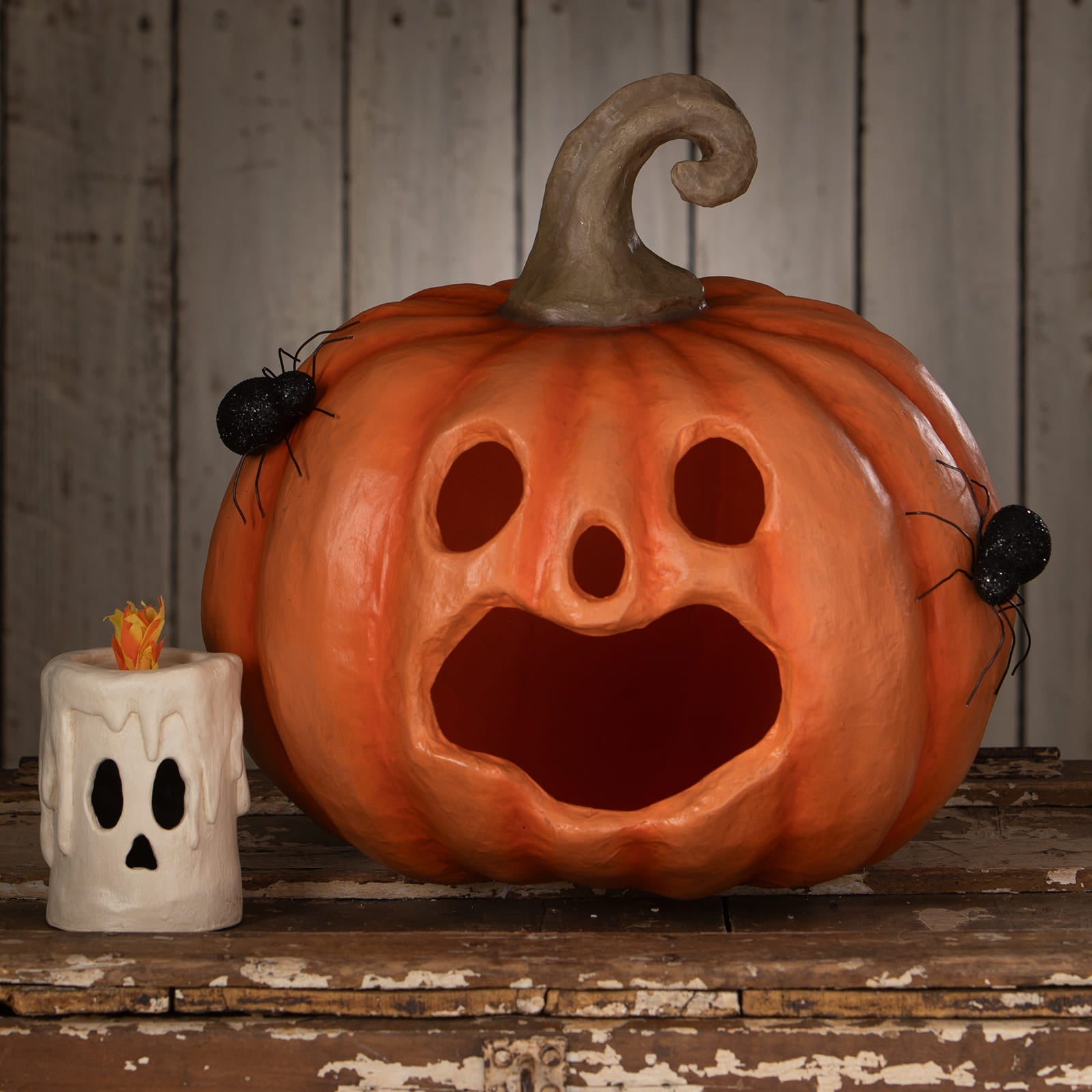 Orange jackie boo lantern halloween pumpkin with twisted stem and black spiders for spooky fall decor