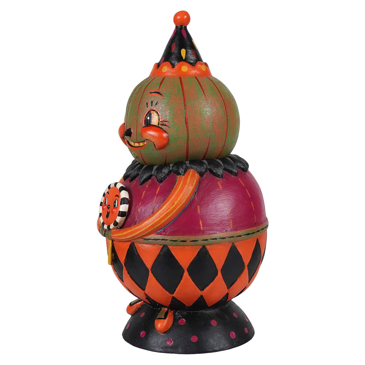 A whimsical jackie green-o-ween spooks jar figurine with a green pumpkin head and black orange harlequin body