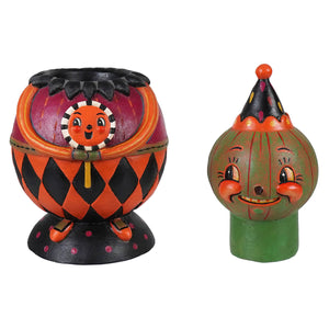Orange and black harlequin pumpkin candle holder with smiling face black spikes and green zipper detail jackie green-o-ween spooks jar