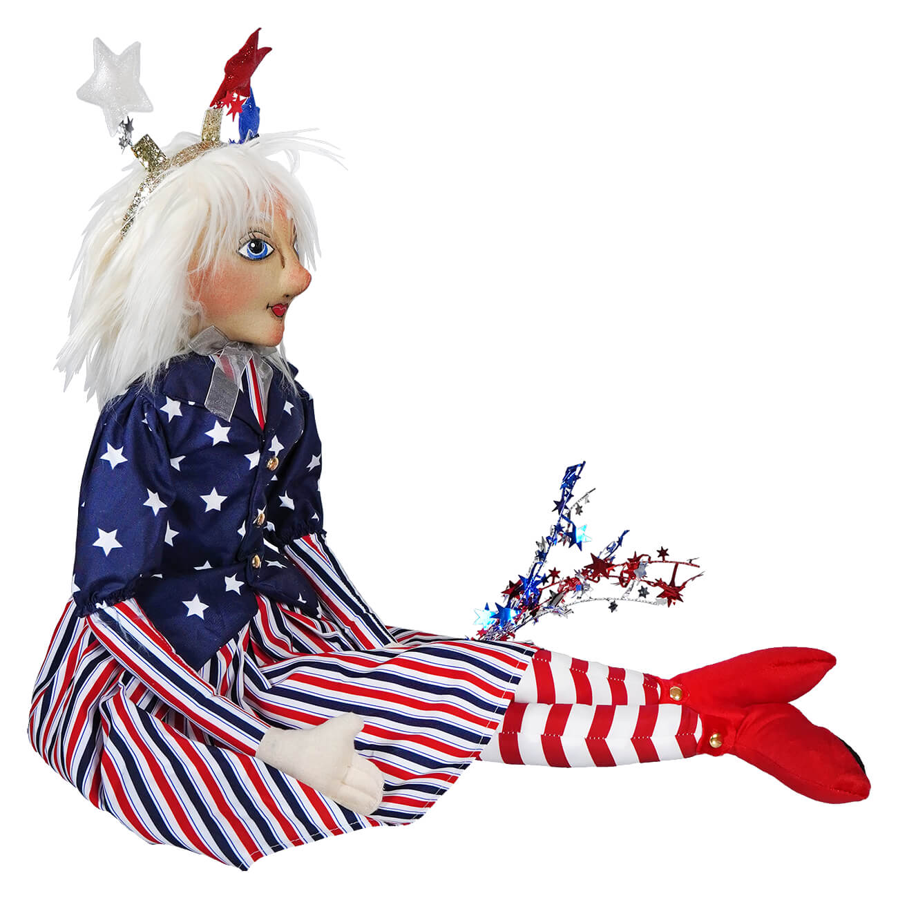 Patriotic doll wearing stars and stripes clothing with white hair and red boots.