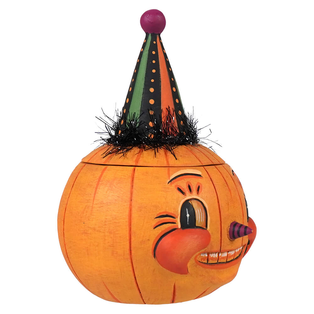 Orange pumpkin-shaped decorative box with smiling face and striped party hat from jackie yell-o-ween collection