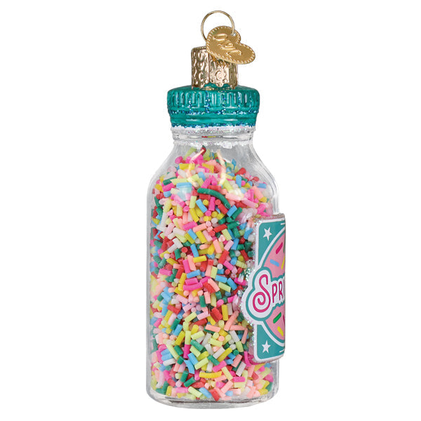 A clear glass jar of sprinkles ornament with colorful rainbow sprinkles teal cap and gold heart keychain figural decor