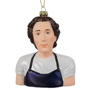 Glass ornament of jeremy allen white featuring a woman with curly brown hair in a white shirt and dark blue apron