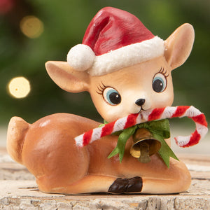 A charming vintage-style ceramic christmas reindeer figurine by bethany lowe wearing a red santa hat and holding a candy cane