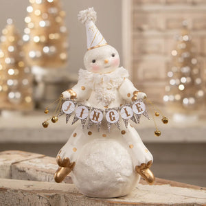 A festive bethany lowe designs christmas snowman figure in white with gold accents holding a glittery jingle banner
