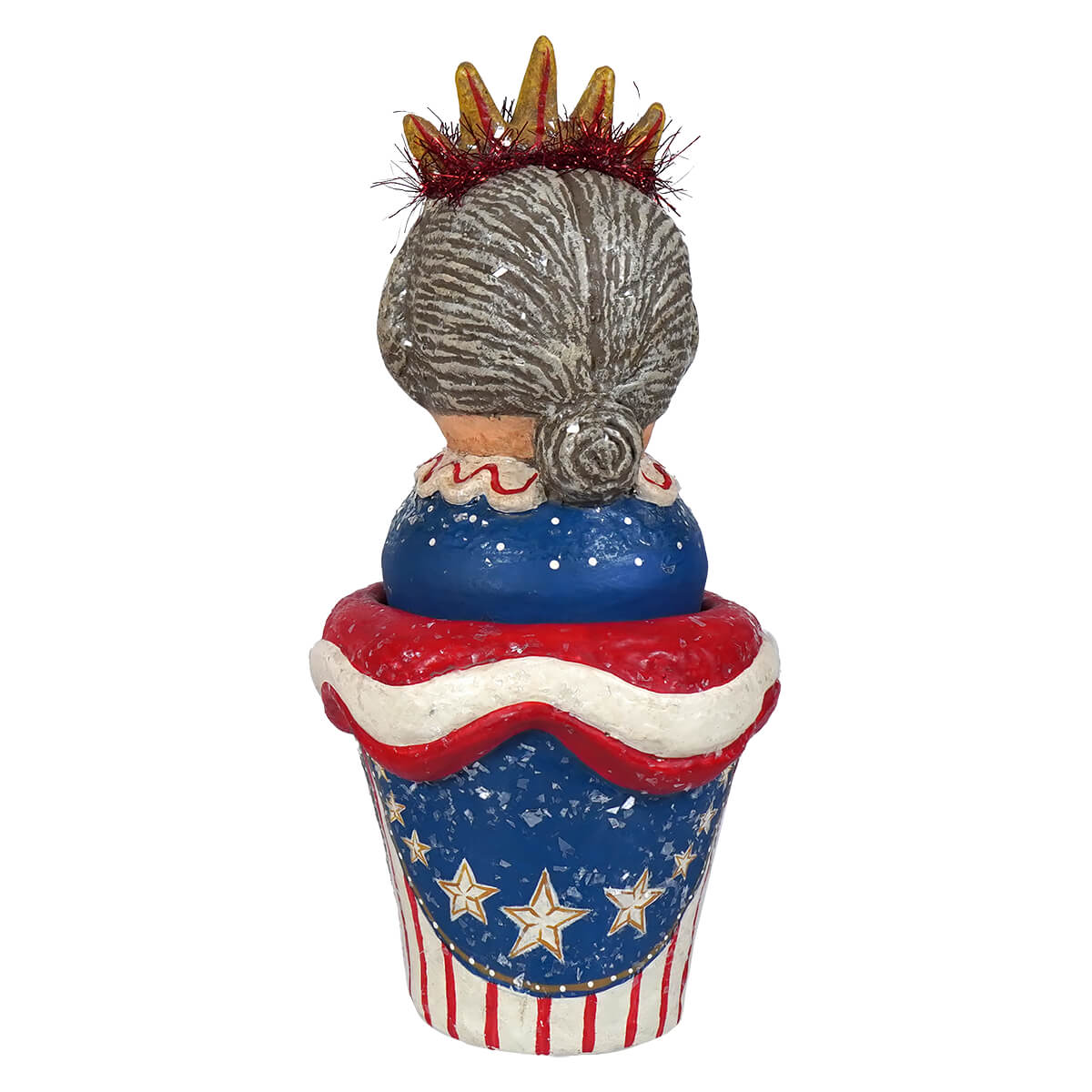 A whimsical johanna parker lady liberty container with gray hair bun and red gold crown on a blue star cupcake