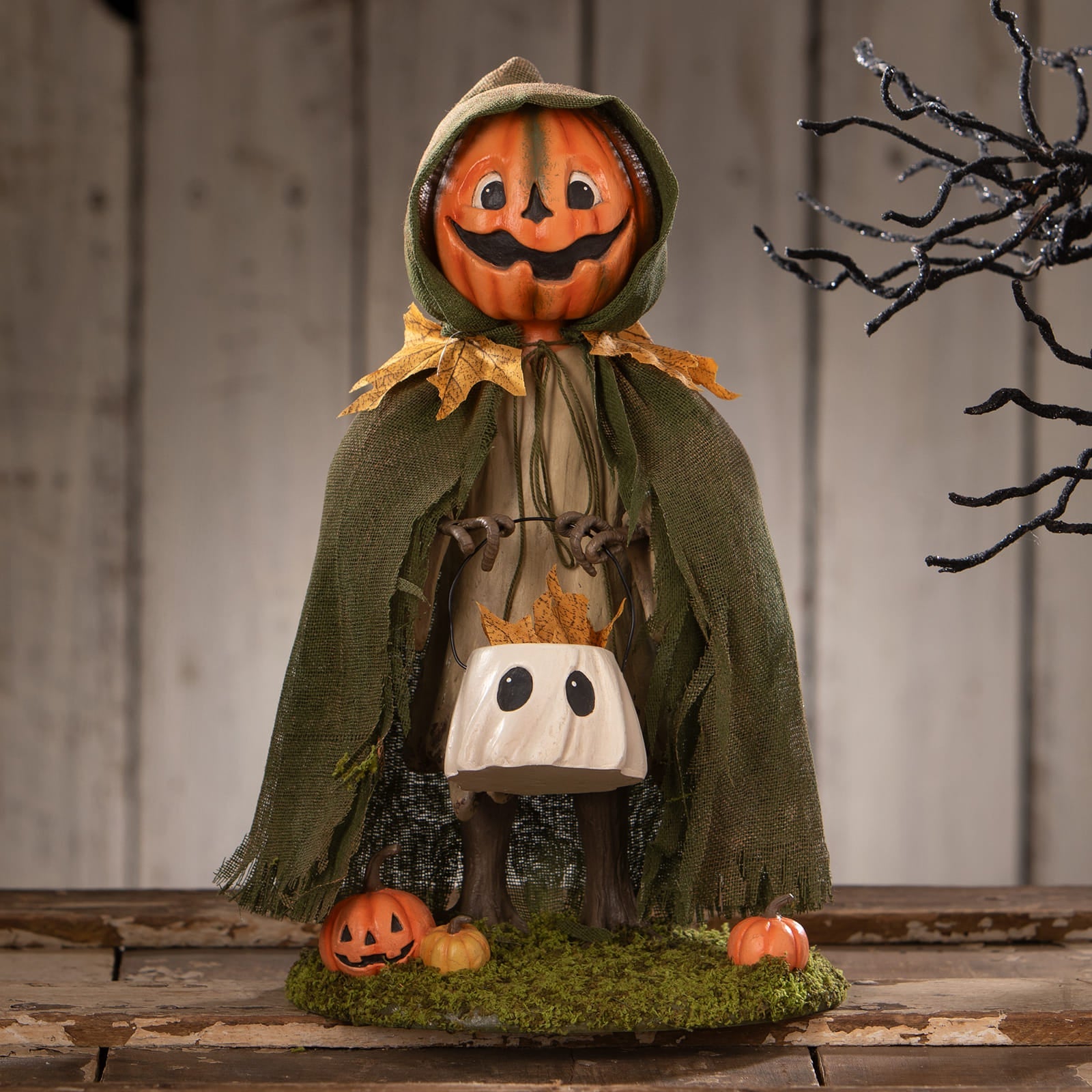 Jolly jack pumpkin halloween figural decor scarecrow with carved orange pumpkin head green hooded cloak and ghost bag