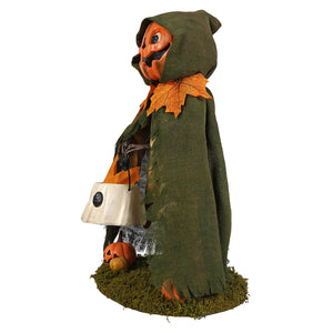 Jolly Jack Pumpkin halloween figural decor with orange pumpkin head and green burlap cloak made of autumn leaves