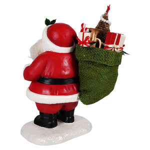 Jolly retro santa figurine by bethany lowe in red and white with black boots carrying green burlap sack of gifts