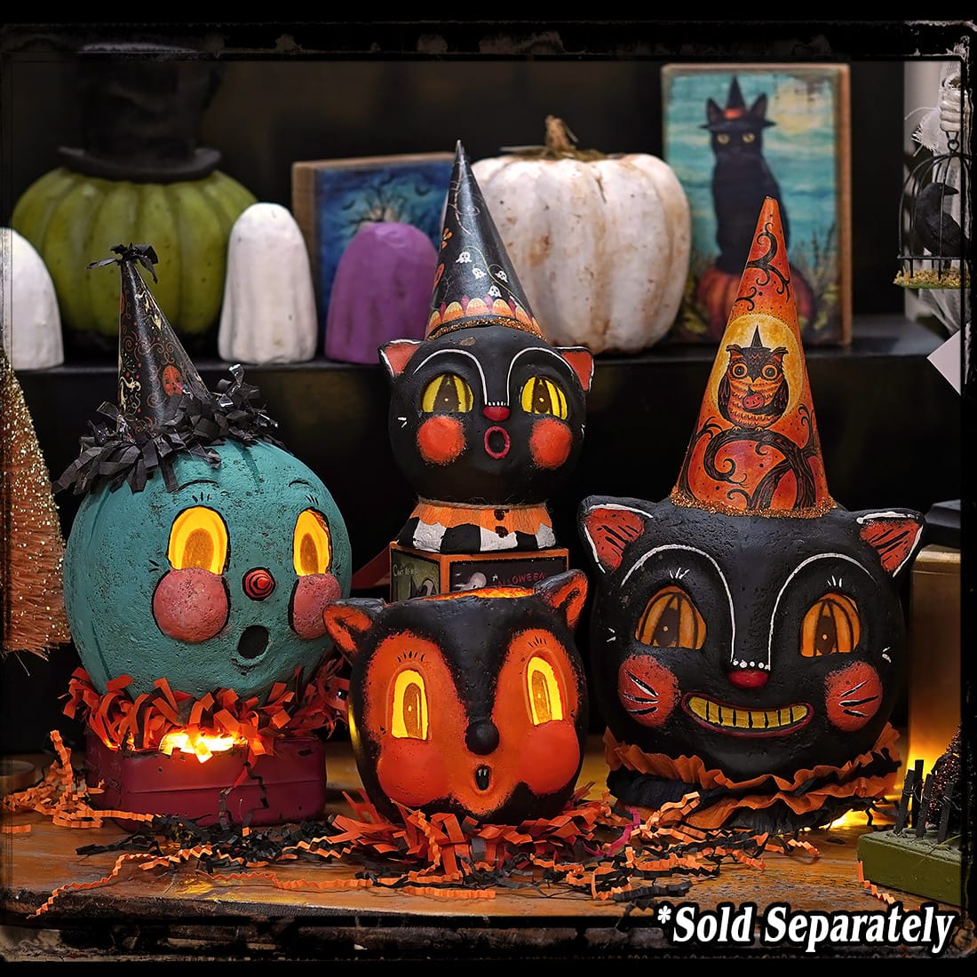 Vintage-style jpd partners in craft teal jack-o-lantern halloween lanterns with glowing orange interiors and festive hats