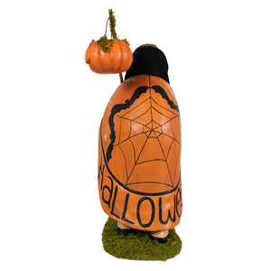 Back of an orange halloween-themed bethany lowe figural decor with black spiderweb design and wee bit wicked pumpkin topper