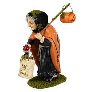 Detailed figural decor of a wee bit wicked witch by bethany lowe in orange black with pumpkin lantern and bag of tricks sack