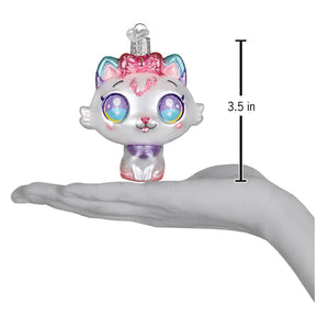 A kawaii cat ornament with white glass, rainbow-tinted eyes, pink bow, and purple glitter accents santa’s kitten ornament