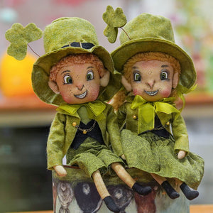 Two green keiran leprechaun dolls with embroidered faces and shamrock hats perfect for st patricks day by joe spencer