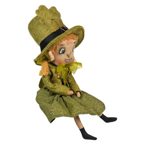 A charming olive-green felt kerry leprechaun doll with stitched face and shamrock hat by joe spencer leprechaun