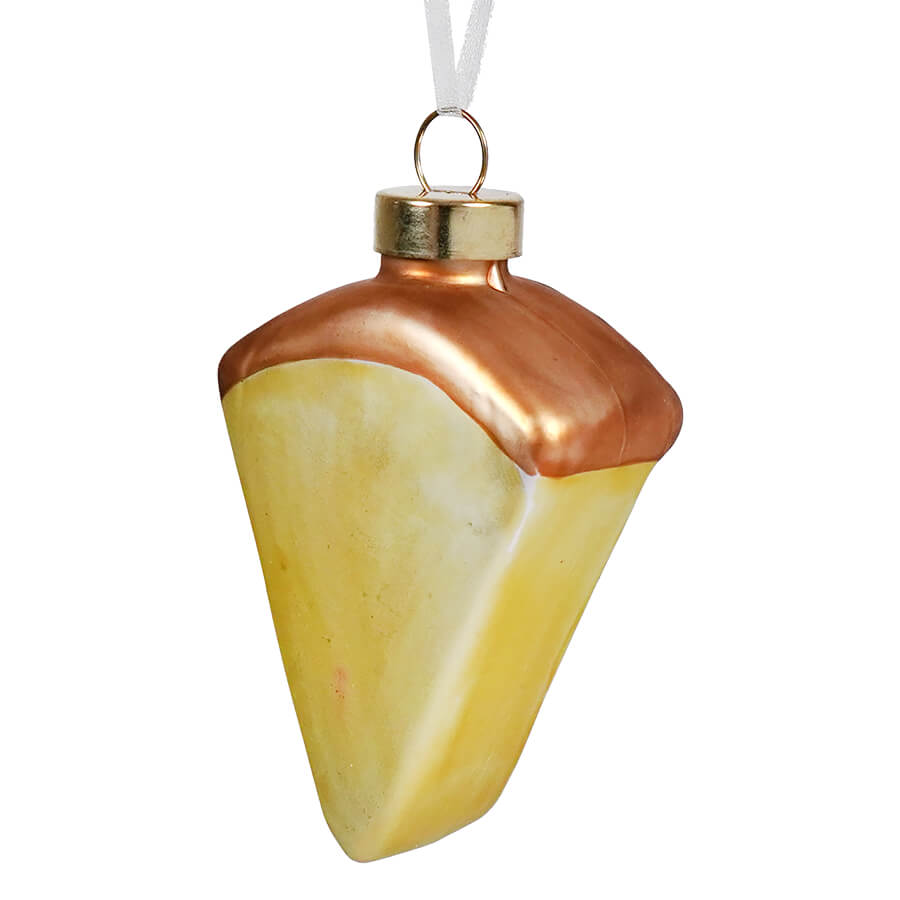A glossy glass key lime pie ornament shaped like a lemon pie slice with copper icing and gold cap, food and drink ornaments