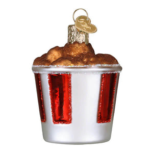 Festive kfc bucket of chicken christmas glass ornament shaped like popcorn bucket with red glitter stripes and golden popcorn