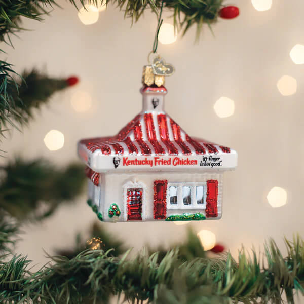 Red and white glass kfc restaurant ornament with striped roof green trim and its finger lickin good slogan christmas glass ornament