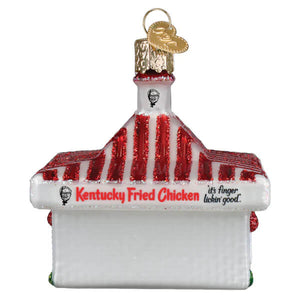 A white glass kfc restaurant ornament with red glittery stripes and a gold hanging loop for christmas decor