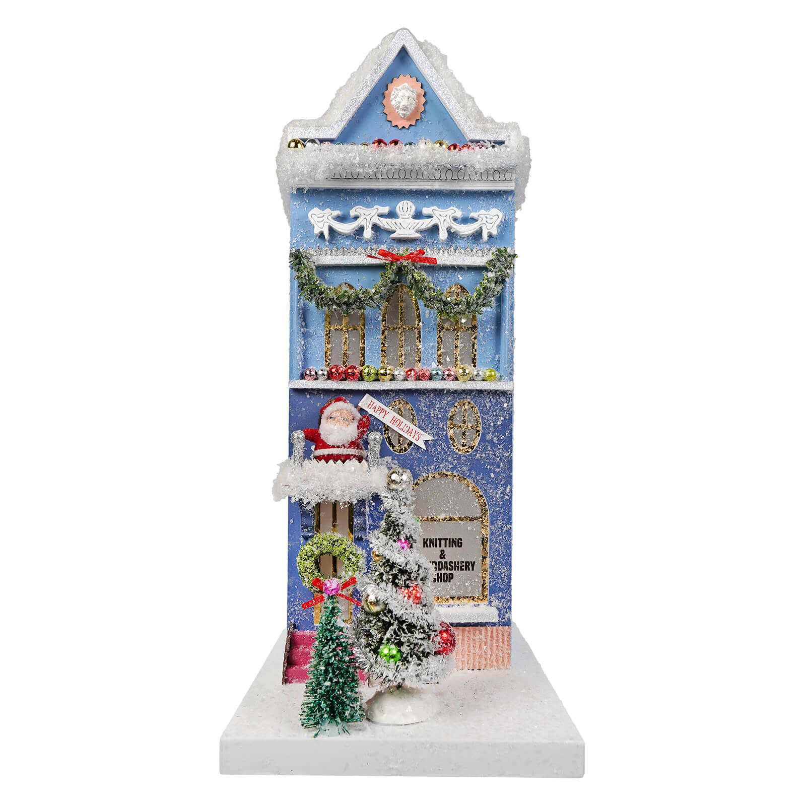 Blue cody foster knitting & haberdashery shop village house with white trim garlands and santa on balcony