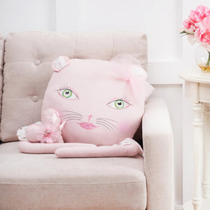 A soft pink cat-shaped zombinaland decorative pillow with green eyes and a bow by tracy scheff pillow