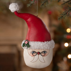 Red and white kris kringle santa ornament with glossy finish and blue eyes from bethany lowe design santa ornaments