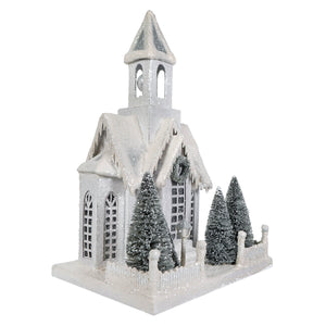 A bethany lowe large ivory church figurine with a glittery snow-dusted roof, bell tower, and light cord included