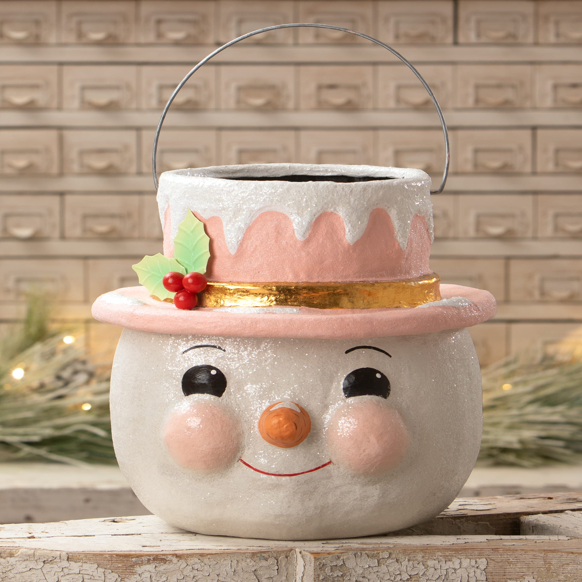 A charming white snowman planter with a pastel holly hat pink cheeks and holly berries from bethany lowe designs christmas snowman figures decor