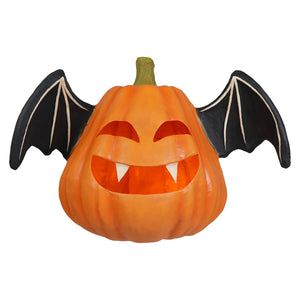 Large pumpkin bat luminary orange pumpkin shaped halloween pumpkin with black wings and white fangs smiling face