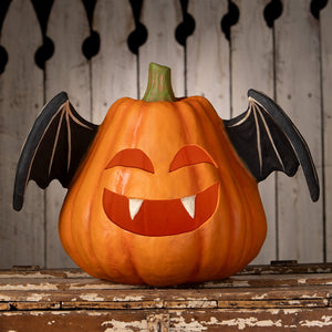Orange pumpkin bat luminary large with black wings and a smiling face featuring white fangs for halloween pumpkins and gourds