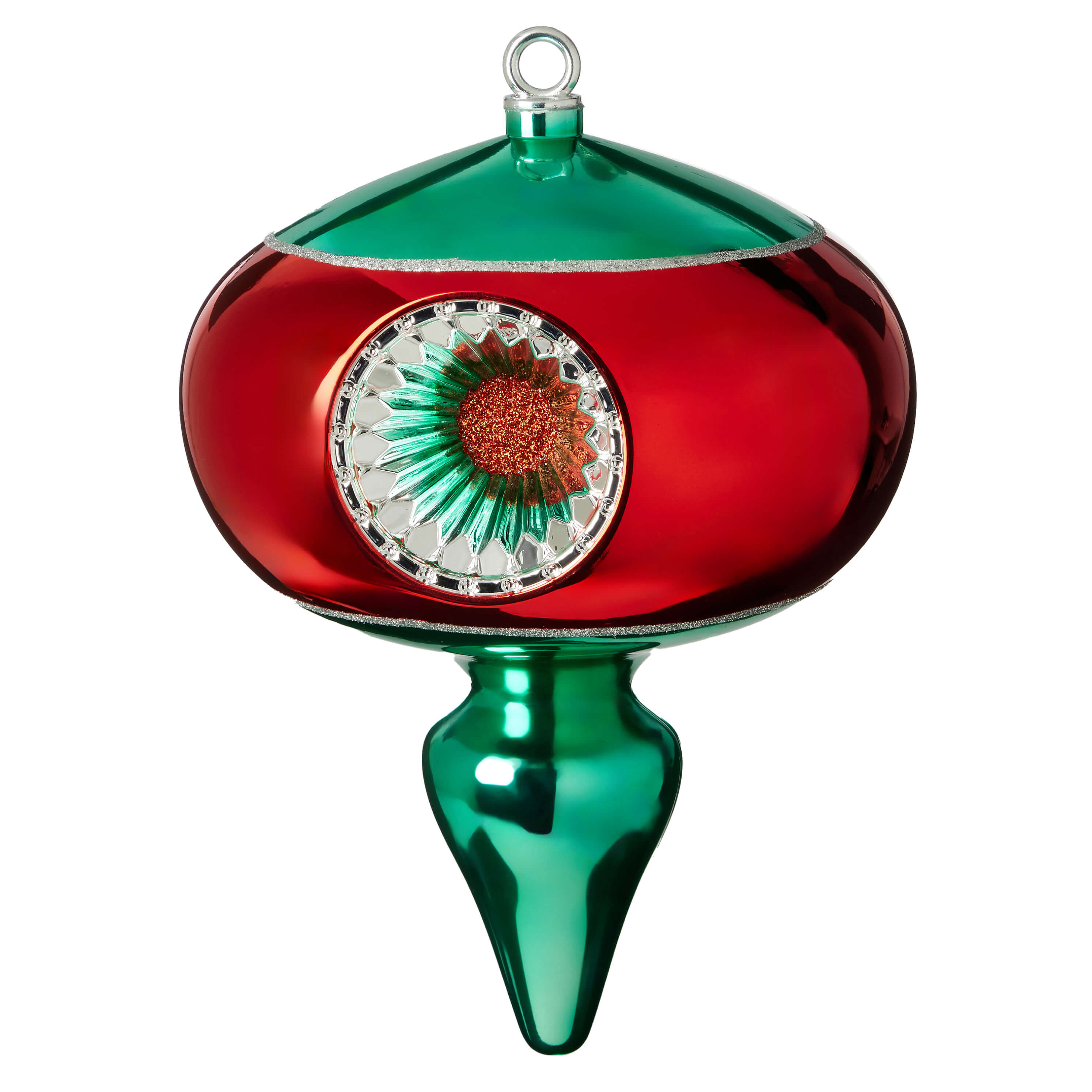 Ornate Christmas tree ornament with a red body, green top and bottom, and a decorative floral design in the center.