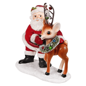 Large retro santa with reindeer figurine showing red and white santa hugging brown reindeer with festive garland folk art santas