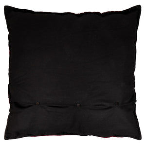 Large santa flying rooftops pillow with black velvet cushion and three dark button closures along bottom edge