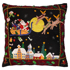 Black large santa flying rooftops pillow with hand stitched wool santa sleigh and reindeer over snow-covered houses