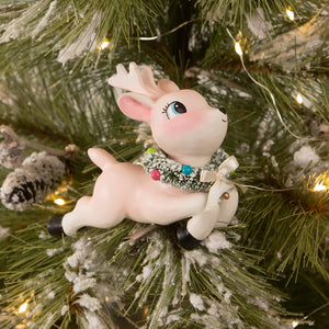 A charming pink ceramic leaping high reindeer clip-on ornament with green garland and colorful beads by bethany lowe designs