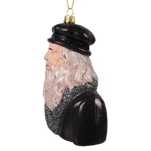 Black glass ornament by cody foster showing leonardo da vinci side profile with glittery silver beard and black hat