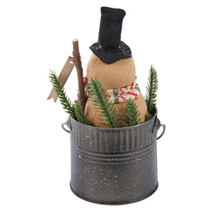 Rustic tan fabric isabella snowman standing with black top hat and red scarf in gray bucket with pine branches by kari emerson design