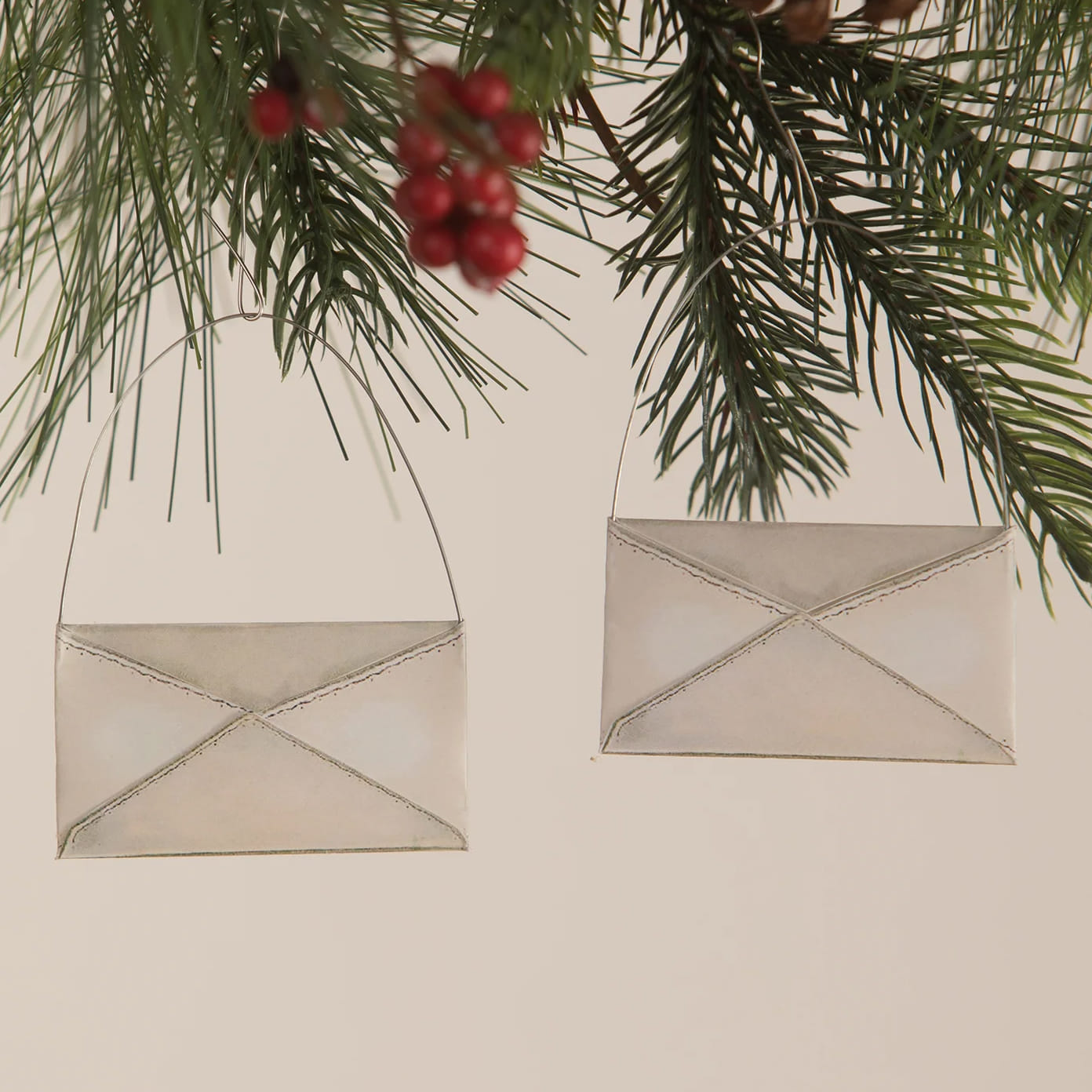Silver metallic envelope shaped santa ornament set of 2 with stitched detailing and hanging loops for tree toppers or lighted decor