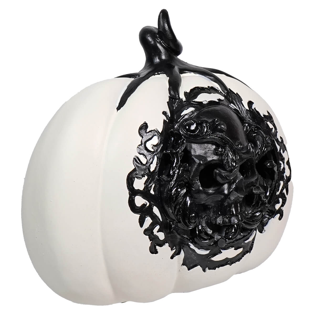 White ceramic pumpkin with intricate black filigree design covering half its surface.