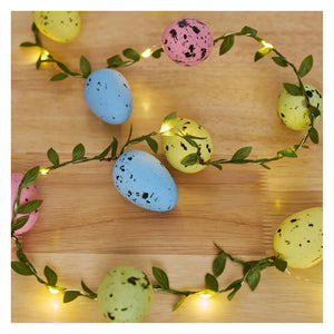 Lighted easter egg garland with pastel speckled eggs on green vine and warm led lights from kathys christmas collection