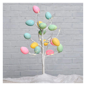 A lighted egg tree with a silver metallic trunk and pastel eggs in pink blue green and yellow for easter decor
