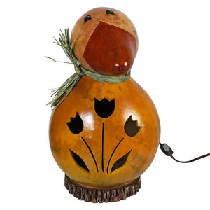 Large dillard duck gourd lamp with tulip and floral cutouts glowing warm light for cozy decor