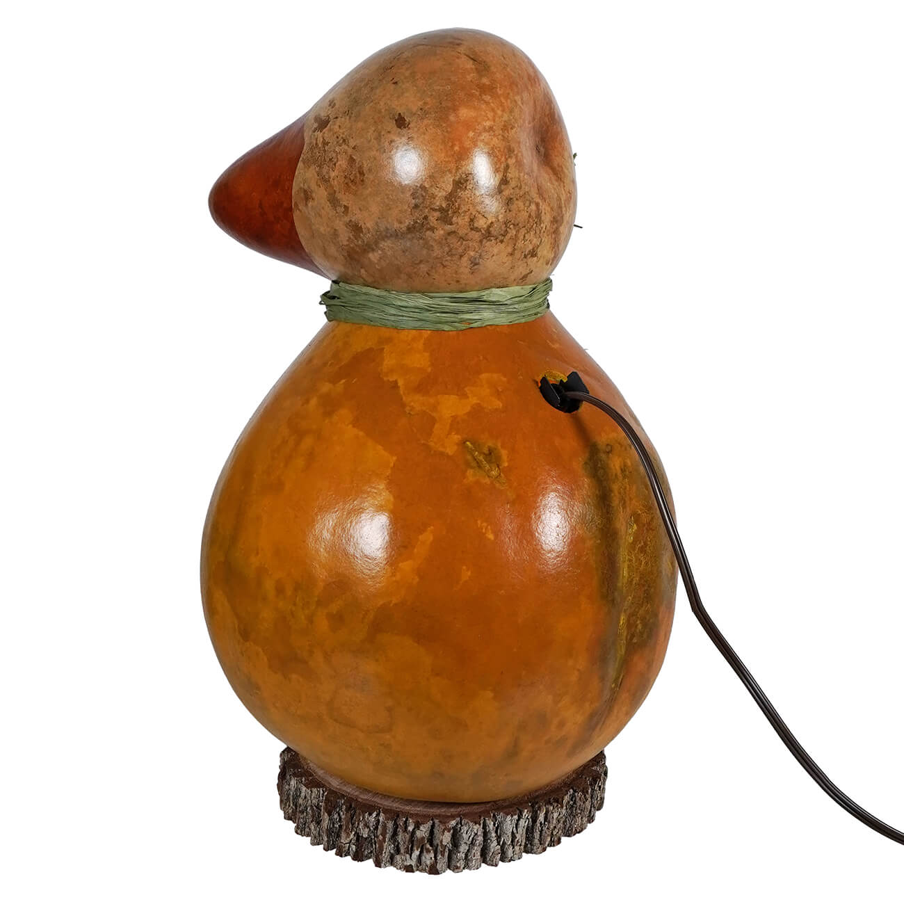 A large dillard duck gourd lamp in amber with a green twine neckband and textured wooden base with tulip cutout