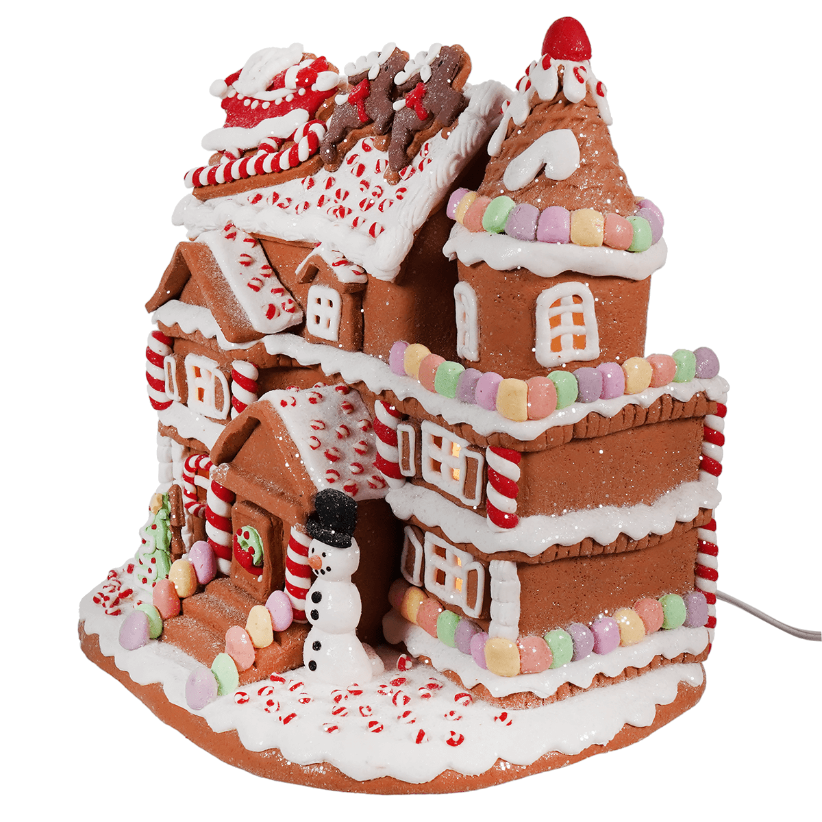 Elaborately decorated gingerbread house with candy and icing details.