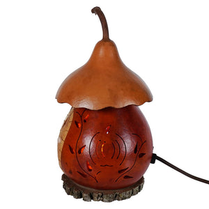 Rustic amber cottage gourd lamp with carved leaf pattern and natural stem by meadowbrooke gourds lighted harvest cottage